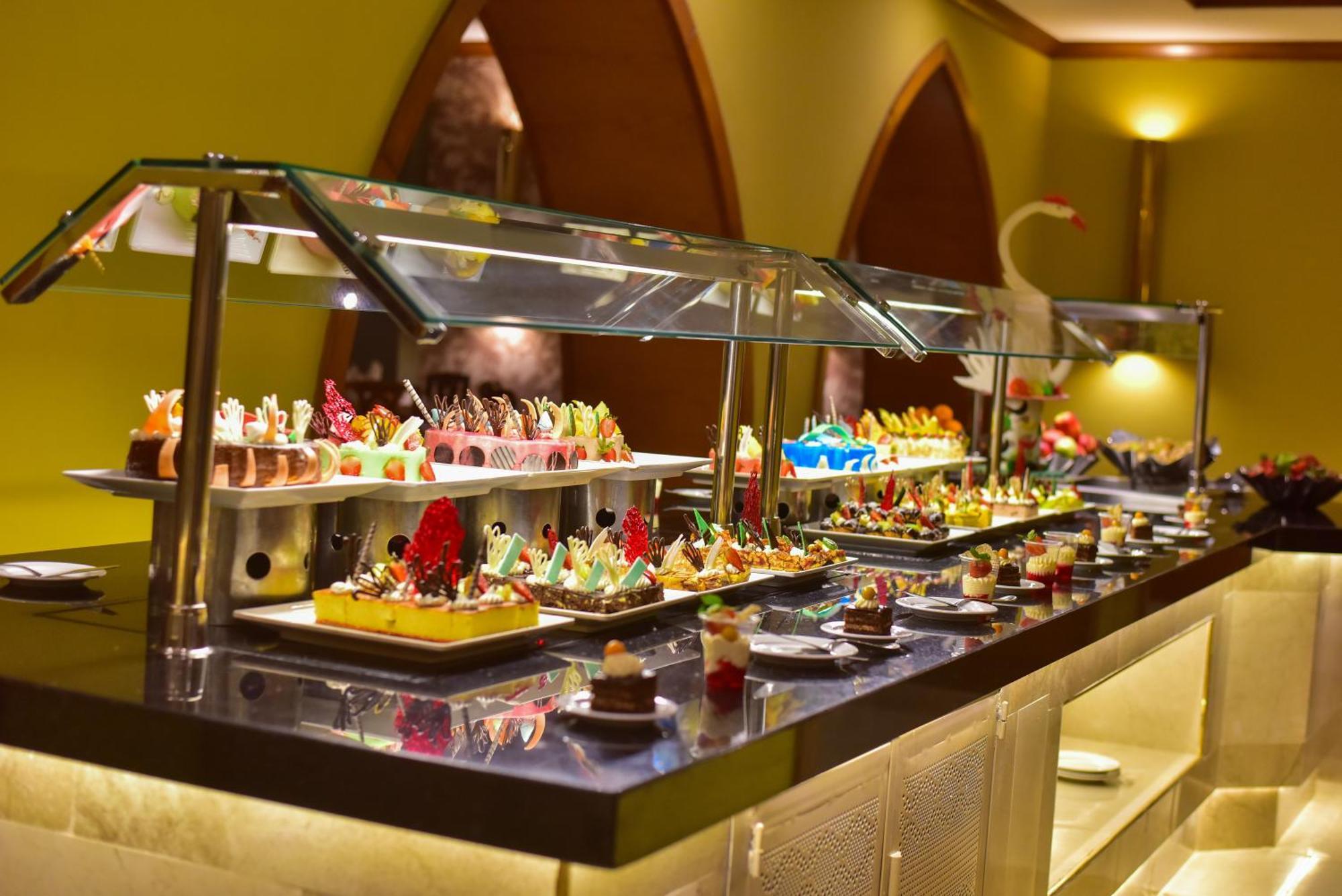 The Grand Hotel Sharm El Sheikh Exterior photo A dessert buffet